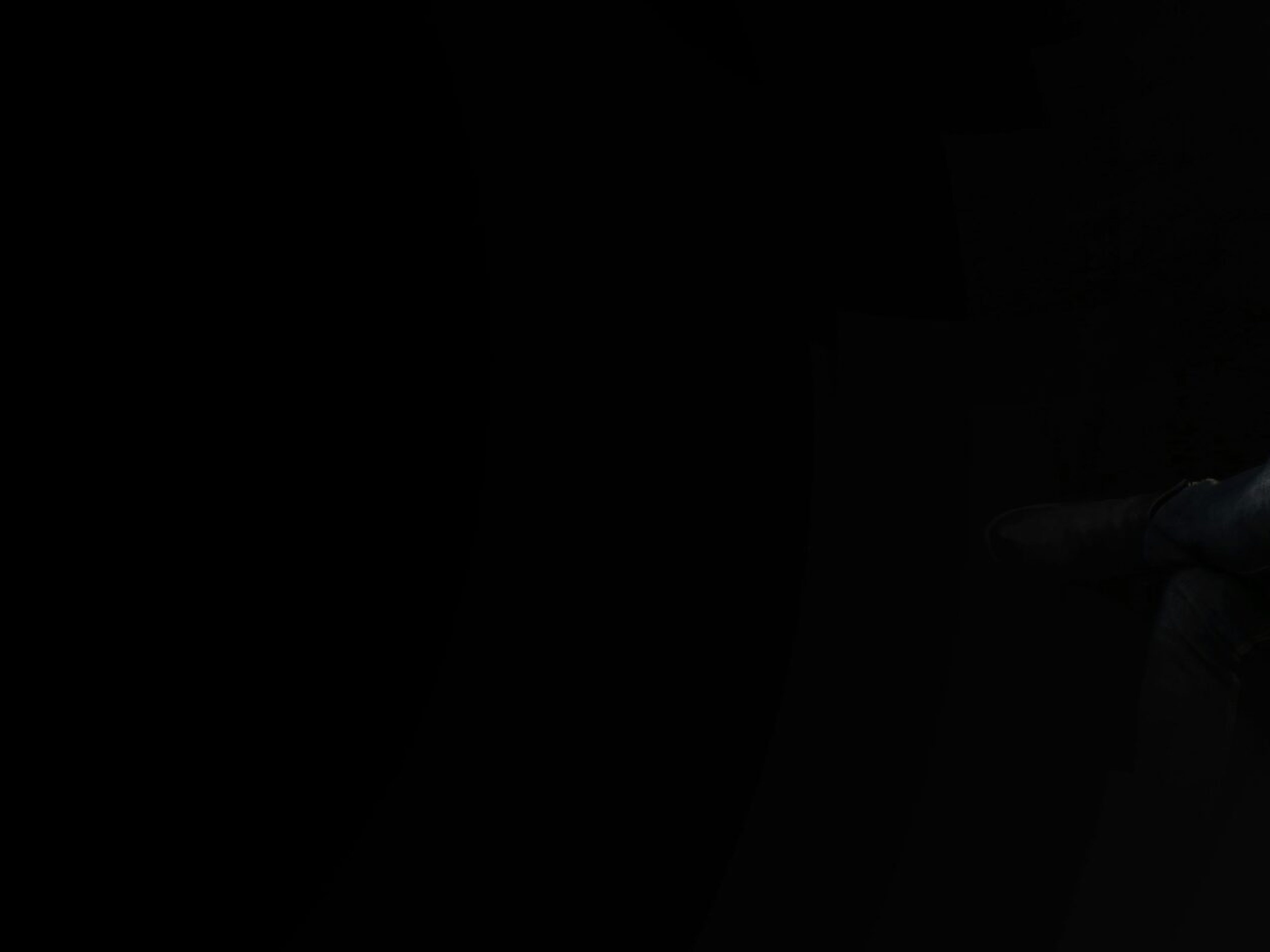 Man Sittin in Black Background